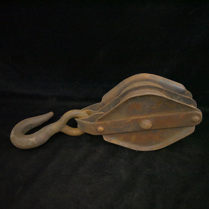 Antique 16-inch double sheave wooden block pulley.
