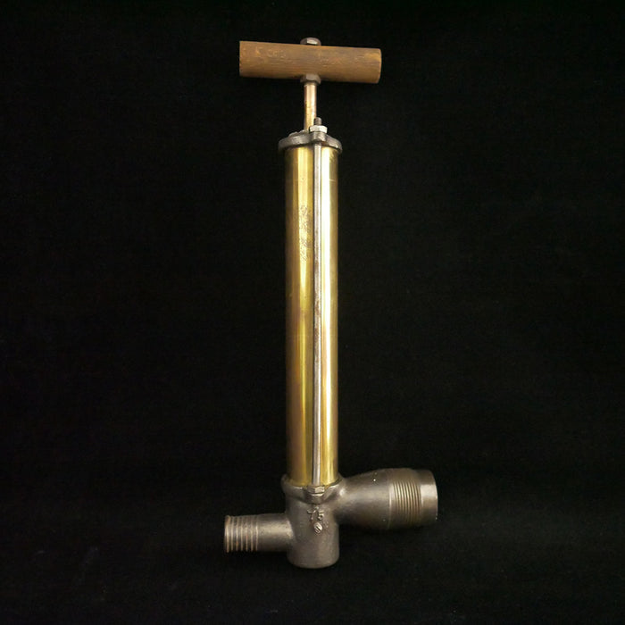 Solid brass antique bilge pump with wooden handle.