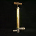 Solid brass antique bilge pump with wooden handle.
