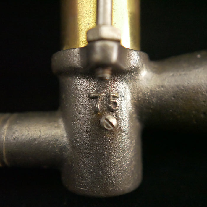 Solid brass antique bilge pump with wooden handle.