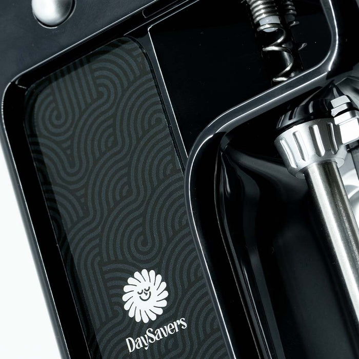 Close-up of DaySavers filling machine tray with logo, chamber, and removable tube assembly