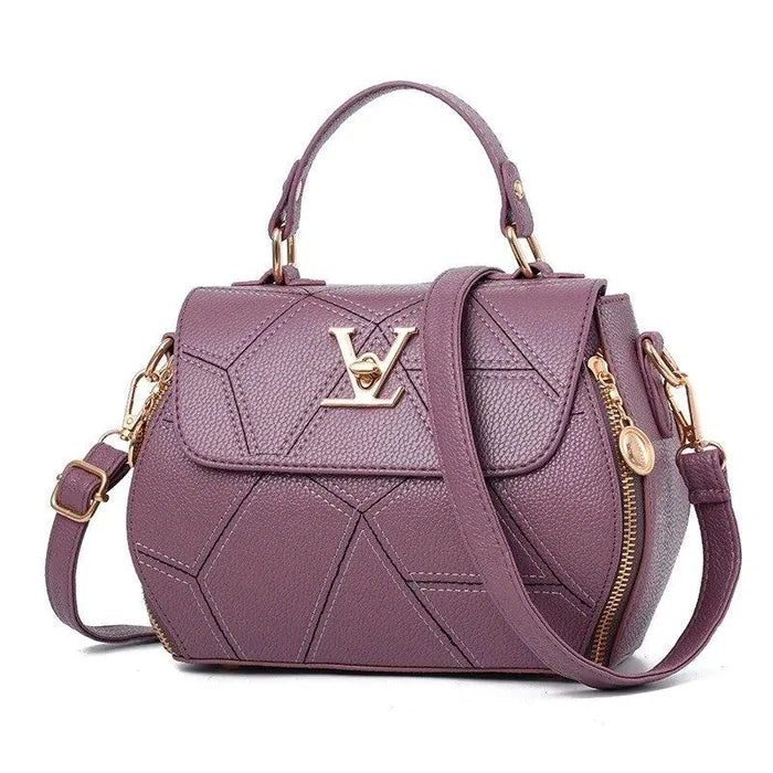 Elegant leather tote bag by MANDOTOS with sturdy handles and sleek design, perfect for everyday use.