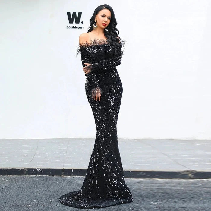Elegant black evening dress by MANDOTOS featuring a fitted silhouette and stylish neckline, perfect for formal occasions.
