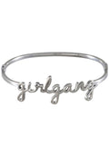Wanderlust + Co Girlgang Bangle in silver with cursive girlgang script on silver plated stainless steel hinged bangle bracelet — front view