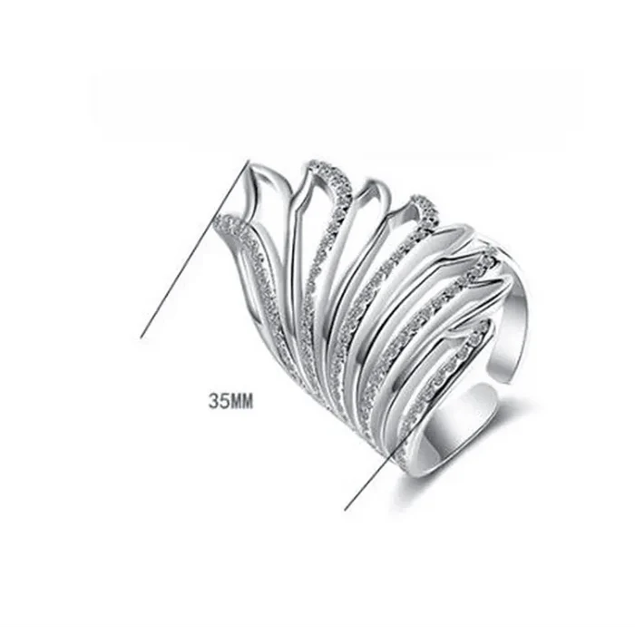 Mandotos Heavenly Diamond Wing Ring featuring sparkling diamond accents and intricate wing design on silver band.