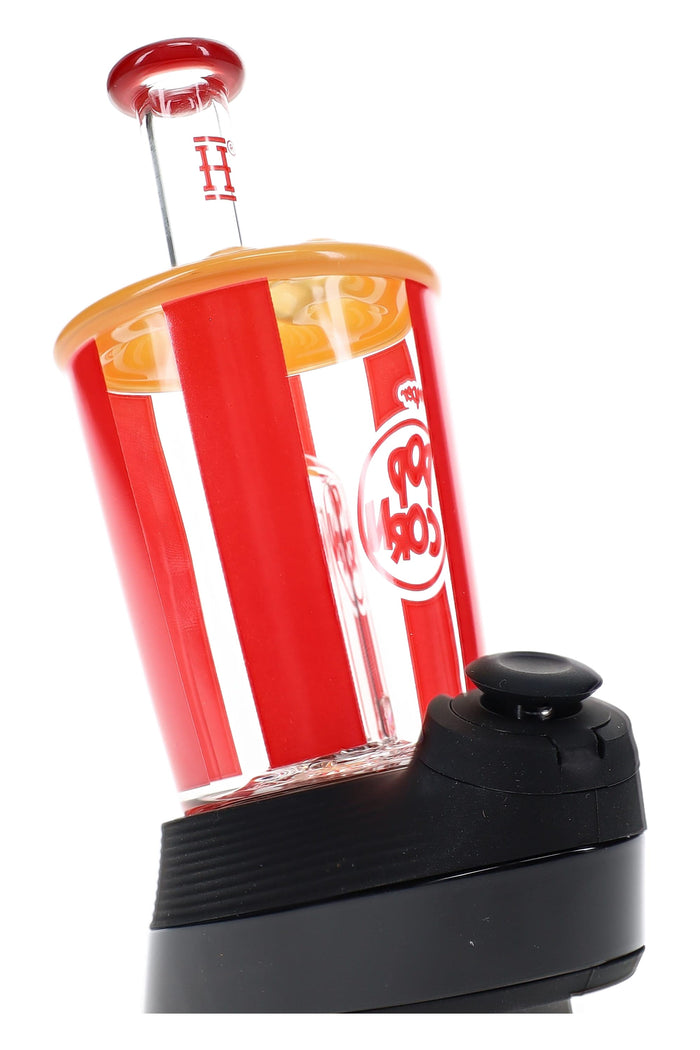 Angled view of popcorn-bucket Peak glass top on device, red striping decals, yellow popcorn top, red mouthpiece