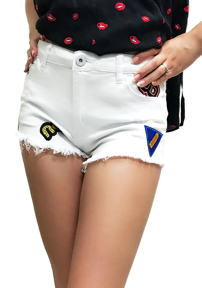 UNIQ Patched Denim Shorts in black with multi-patch details on rave bottoms — front view