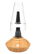 Zenco Flow desktop vaporizer in wood finish with clear water glass, black mouthpiece, and auto-fill cup design centered on the base.